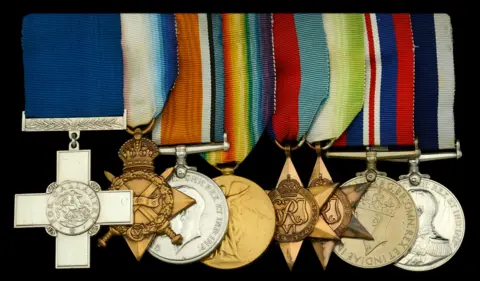 Noonans Eight medals including the George Cross, the 1914-15 Star, British War Medal 1914-20, Victory Medal 1914-19 and Atlantic Star. The George Cross is mounted on a dark blue ribbon with others on multi-coloured striped ribbons