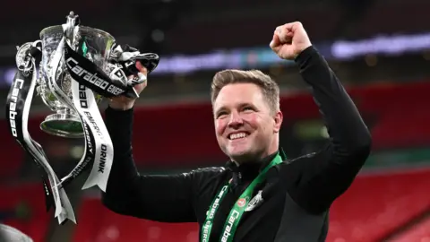 Eddie Howe celebrates Carabao Cup win with trophy