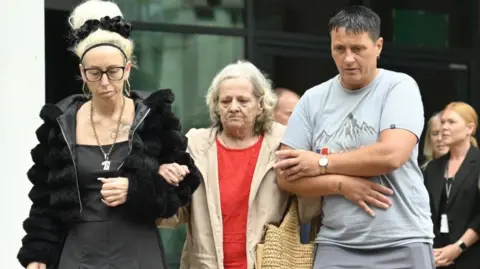 PA Media Preston Davey's birth mother Sarah Davey is walking out of Preston Crown Court with her family. 