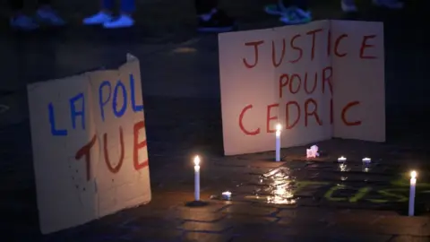 Getty Images A candlelight memorial for Cédric Chouviat, in January, soon after his death