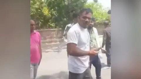 Man survived the Air India crash that killed at least 200 people walking