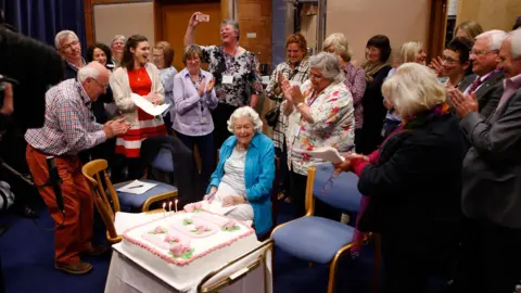 The cast and crew of The Archers celebrating June Spencer's 100th birthday in 2020