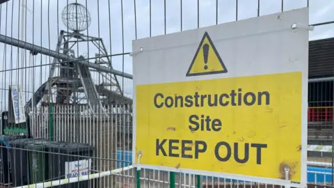 Andrew Turner/BBC A construction site sing at a Great Yarmouth Pleasure Beach