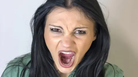 Thinkstock Woman swearing