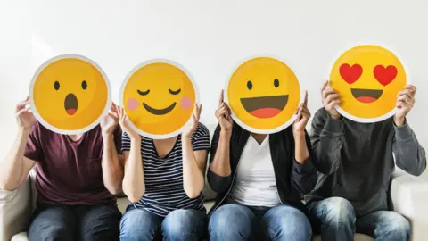 Getty Images Picture of people's heads as emojis