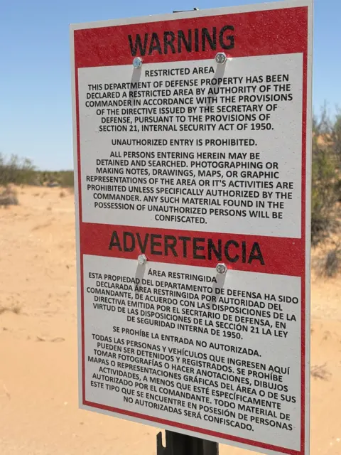 Daniel García Marco / BBC Mundo A sign warns migrants they are entering a restricted area