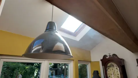 Smoke from burned toast hangs in the air as sunlight highlights the pollution in the air.