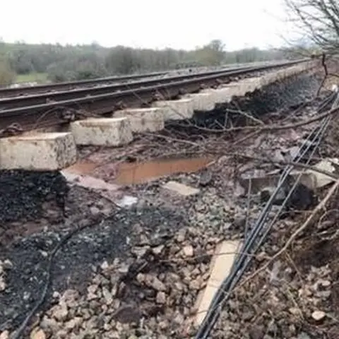 TfW The rail bed has been washed from under rail lines