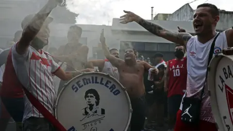 Getty Images Fans of Argentinos Juniors' football team, where Argentinian football legend Diego Maradona used to play gather outside the stadium