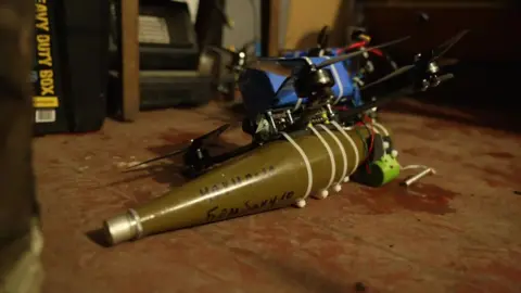Drone with a grenade on it