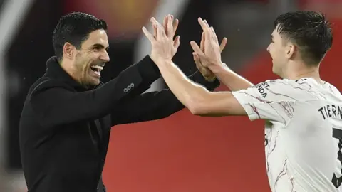 Arsenal boss Mikel Arteta celebrates his side's win with Kieran Tierney