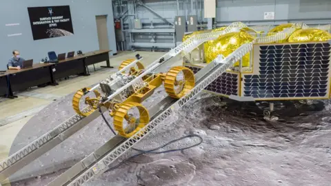 BILL STAFFORD / Nasa JSC Engineers use a full-scale model of the Griffin lander to test how a well a prototype rover can move down its ramp to the surface