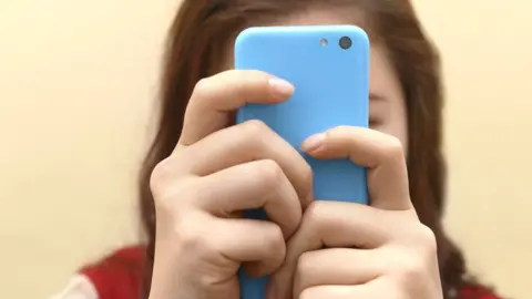 Getty Images Mobile phones in school