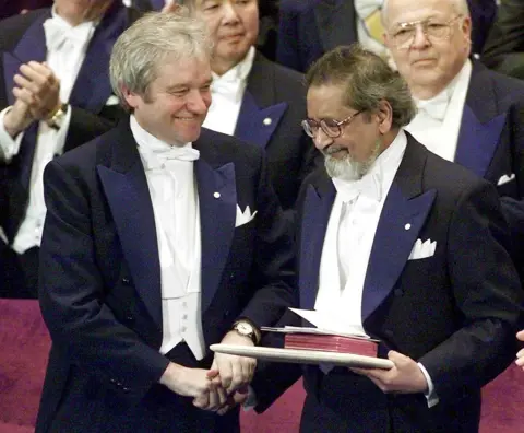 Gerry Penny/EPA/REX/Shutterstock VS Naipaul and Paul Nurse