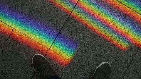 Twitter/ @MVPicsss Rainbow on pavement