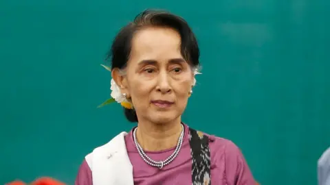 EPA Myanmar's State Counsellor Aung San Suu Kyi leaves after speaking during the Myanmar Education Development Implementation Seminar at Myanmar International Convention Center (MICC - 2), in Naypyitaw, Myanmar, 8 December 2017