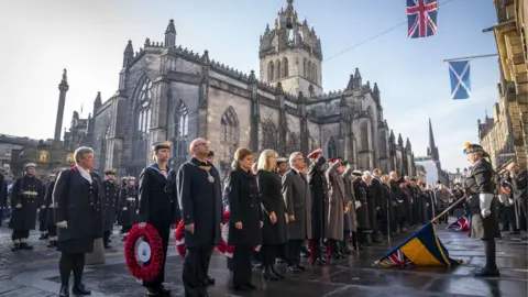 PA Media First Minister of Scotland Nicola Sturgeon and the Lord Provost of the City of Edinburgh Robert Aldridge, along with other dignitaries and members of the Armed Forces during a Remembrance Sunday service and parade in Edinburgh. Picture date: Sunday November 13, 2022. PA Photo. See PA story MEMORIAL Remembrance Scotland. Photo credit should read: Jane Barlow/PA Wire