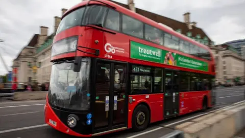 Getty Images Red bus crossing Waterloo bridge, London