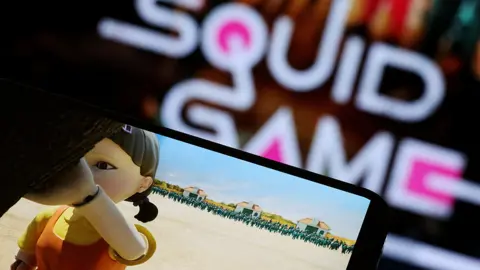 Reuters The Netflix series "Squid Game" is played on a mobile phone