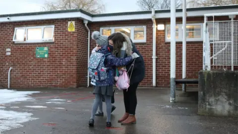 Press Association parent child hug school