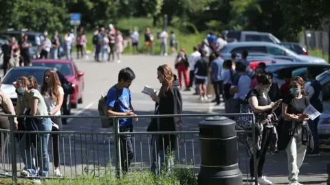 PA Media People queuing to go into Belmont Health Centre in Harrow which is offering a first dose of Pfizer coronavirus vaccine to anyone aged over 18 on Saturday and Sunday who is living or working in Harrow.