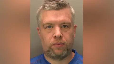 Lincolnshire Police Mugshot of Wayne O'Rourke who is wearing a blue football-style top