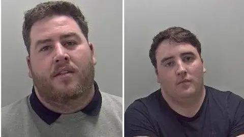 Mugshots of two men places side by side. Both are white men with short brown hair. The man on the left wears a light grey jumper with a dark collar and the man on the right wears a black t-shirt. There is a grey background for both pictures.