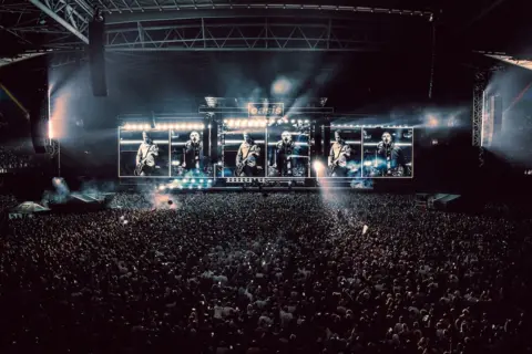 Big Brother Wide shot of Oasis on stage in Cardiff