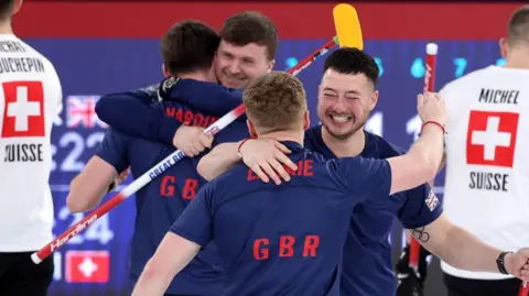 Getty Images Team GB celebrating its semi-final win at the Winter Olympics over Switzerland which got them to the gold medal final