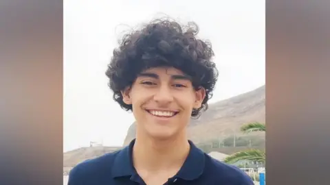 Luis Gabriel Guembes - a teenager in a blue polo top, with black curly hair.