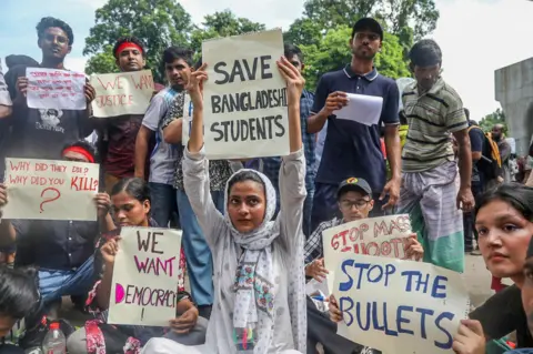 EPA Protesters hold up placards during a 'March for Justice' in front of the Supreme Court area in Dhaka, Bangladesh, 31 July 2024. A nationwide 'March for Justice' was called on 31 July by the Students Against Discrimination group, which has led the quota reform protests, in courts, campuses and on the streets to protest against the 'killings, attacks, and enforced disappearances', and to demand an investigation by the United Nations into the violence that occurred during the student-led protests against the government's job quota system, according to the group's coordinator. Anti-quota protesters call for nationwide 'March for Justice' in Bangladesh, Dhaka - 31 Jul 202