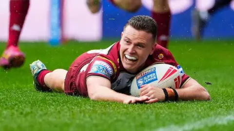 Wigan Warriors full-back Jai Field scores a try against St Helens
