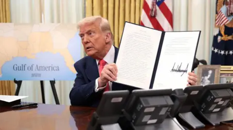 Getty Images US President Donald Trump portrays signing an executive order on March 6, 2025 at the White House Oval Office. 