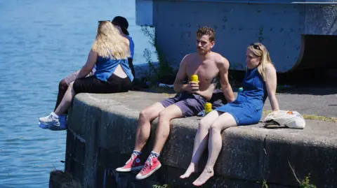 People enjoy the hot weather in Bristol, as the third heatwave of the summer hits the UK. Picture date: Sunday July 13, 2025.