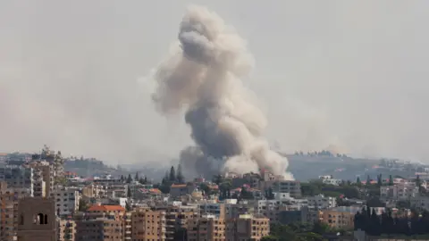 Reuters Smoke billows following an Israeli strike near Tyre, south Lebanon (23 September 2024)