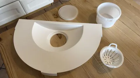 Miscarriage collection kit on a kitchen table.