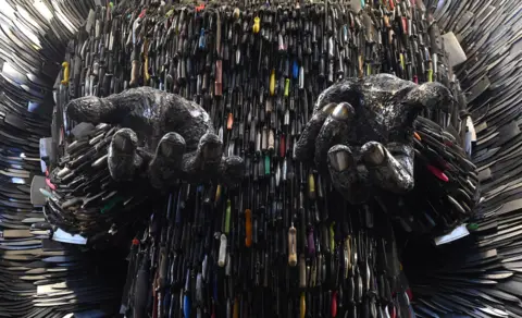 PA Media Close up detail of the hands of the Knife Angel sculpture, showing the knives used to create it. The Knife Angel is made up of 100,000 knifes, collected by 41 police forces across the country through amnesties and confiscations