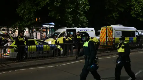 Police at the scene of the unrest on August 3. 