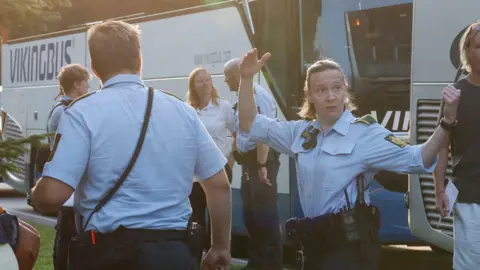 Reuters Danish police direct people involved near the derailment