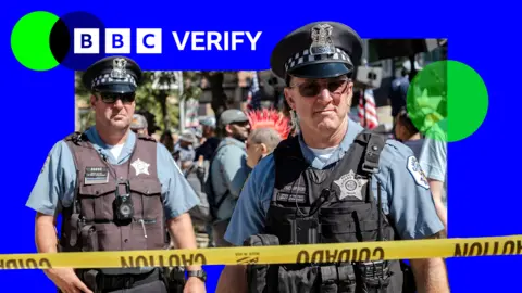 Police stand behind a yellow tape during a Labor Day protest in Chicago, Illinois. 