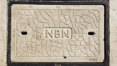 Getty Images A signs in concrete says "NBN"