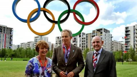 Getty Images Tessa Jowell, Tony Blair and Sir Charles Allen, the mayor of the Olympic Athletes village, in 2012