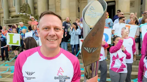 Getty Images Antony Cotton takes part in The Queen's Baton Relay on July 16 in Bolton