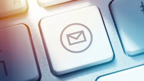 Getty Images Email button on computer keyboard
