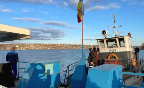 BBC The ferry that transports people across from Molovata Noua to the rest of Moldova - the only link the enclave has with the rest of Moldovan-controlled territory