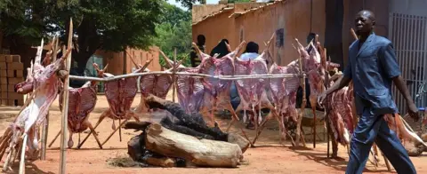 AFP A man walks past sheep carcases staked around a log fire along a street in Niamey as Muslims celebrate Eid al-Adha on September 12, 2016. Muslims across the world celebrate the annual festival of Eid al-Adha, which marks the end of the Hajj pilgrimage to Mecca and commemorates prophet Abraham's readiness to sacrifice his son to show obedience to God.