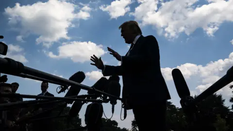 Getty Images Trump speaks to reporters