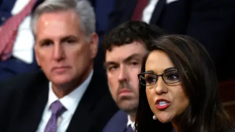 Getty Images Lauren Boebert attacks Kevin McCarthy (L) as she nominates another Republican for Speaker