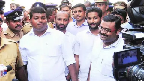 PTI The convicts come out of the court after the verdict in Kochi on Friday.