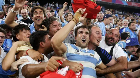 Juan Cruz Mallia of Argentina celebrates victory with members of the crowd